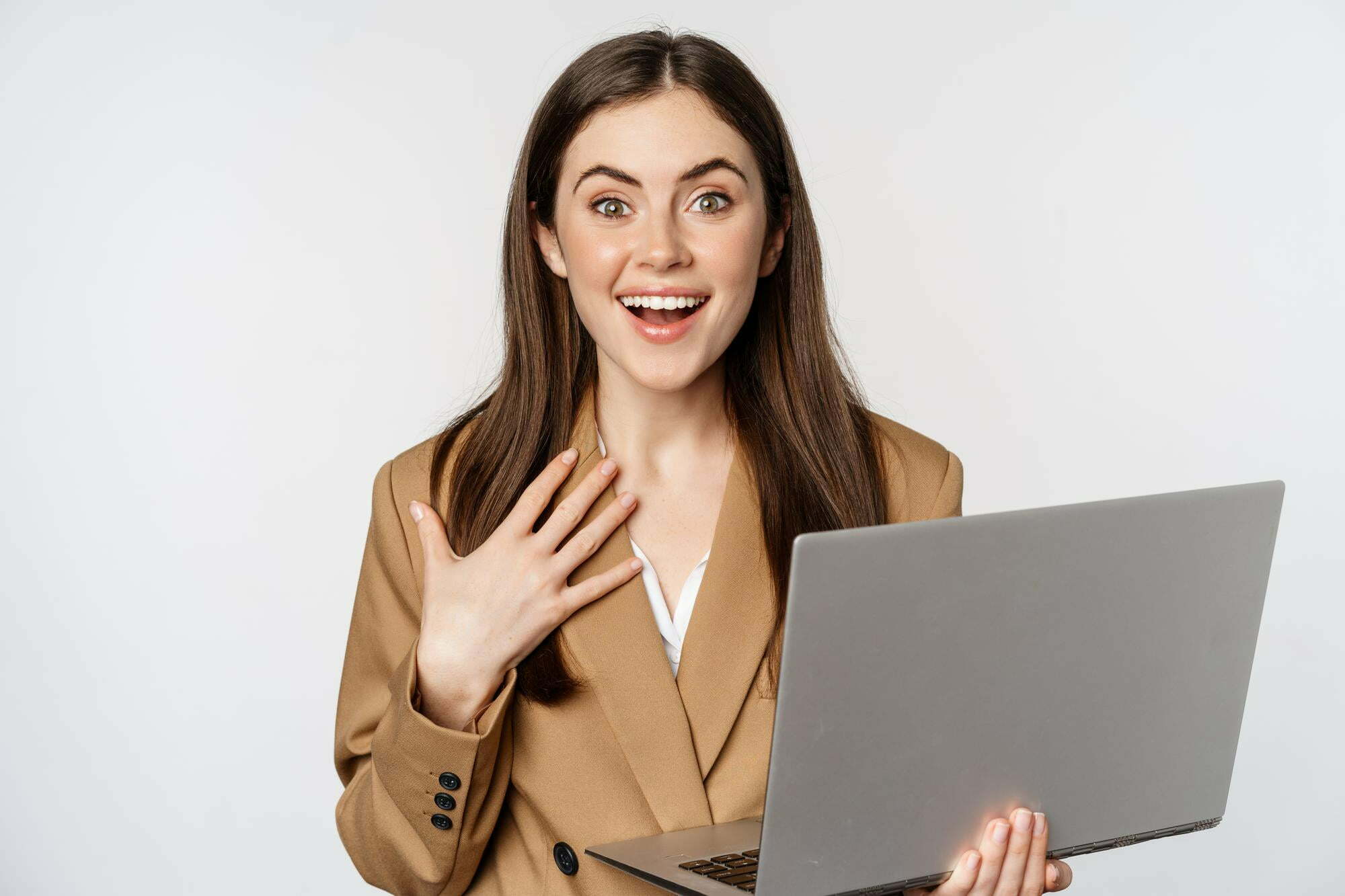 surprised-excited-businesswoman-holding-laptop-reacting-amazed-smth-awesome-standing-suit-white-background.jpg